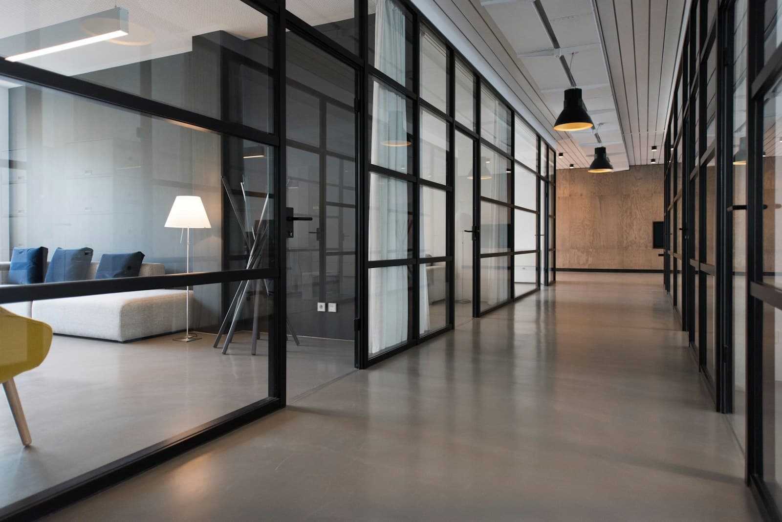 Light, glass and warm materials in a thoughtfully designed creative workspace